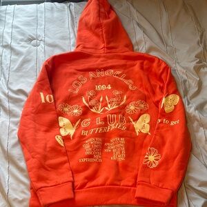 Orange Hoodie with Butterfly Print